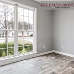 Bright living room with newly installed large windows