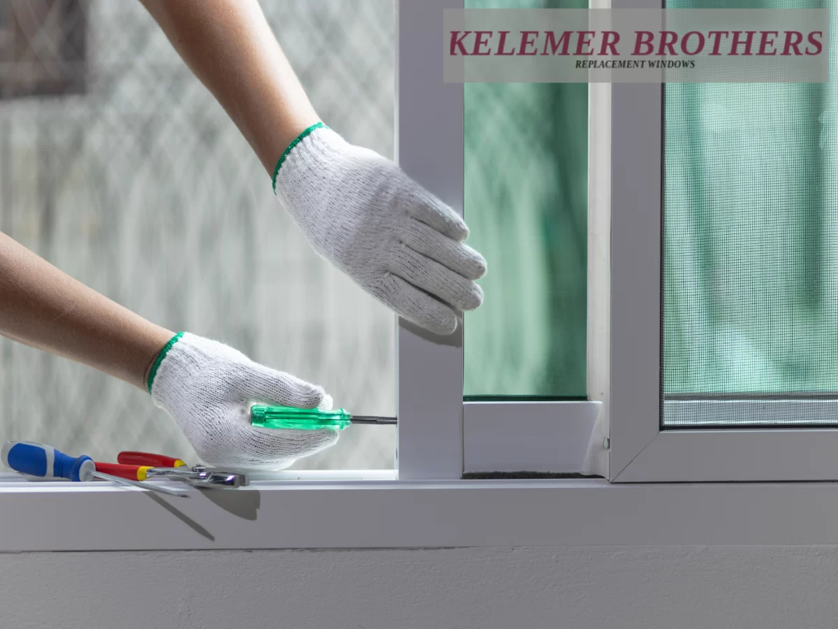 Adjusting a window frame with a screwdriver.